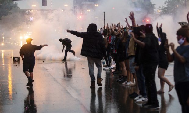 MINNEAPOLIS, MN - MAY 26: Tear gas is fired as protesters clash with police while demonstrating aga...