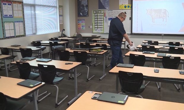 FILE: Hospital grade electrostatic sprayer is used to clean a classroom....