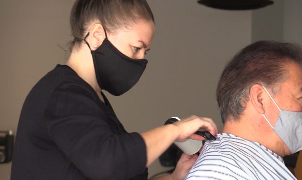 Stylists dawn masks at Metier Salon and Spa in Salt Lake City...