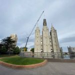 As part of a renovation process, crews remove the Angel Moroni from the Salt Lake Temple on May 18, 2020 (Photo: Meghan Thackrey)