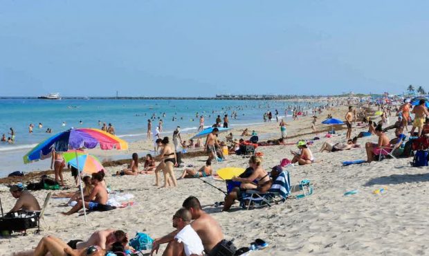 FILE: Miami-Dade County Mayor Carlos Gimenez says all beaches and parks in the county will close fr...