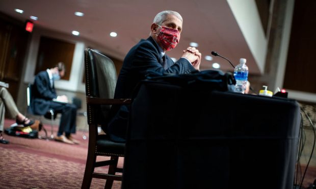 Dr. Anthony Fauci, director of the National Institute of Allergy and Infectious Diseases, listens d...