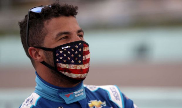 Bubba Wallace, driver of the #43 World Wide Technology Chevrolet, stands on the grid prior to the N...