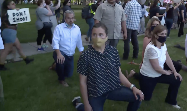 Salt Lake mayors Erin Mendenhall and Jenny Wilson kneeled with protesters on Thursday....