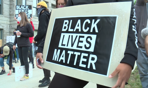 A demonstrator holds a Black Lives Matter at a protest in Salt Lake City in June 2020....