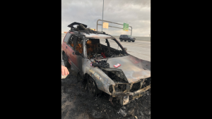 A UHP trooper sprang into action to break out the windows of a burning car on June 14, 2020, to make sure no one was inside. 