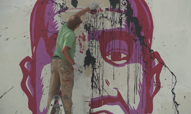 Volunteers repaired the mural of George Floyd in Salt Lake City after it was vandalized over the we...