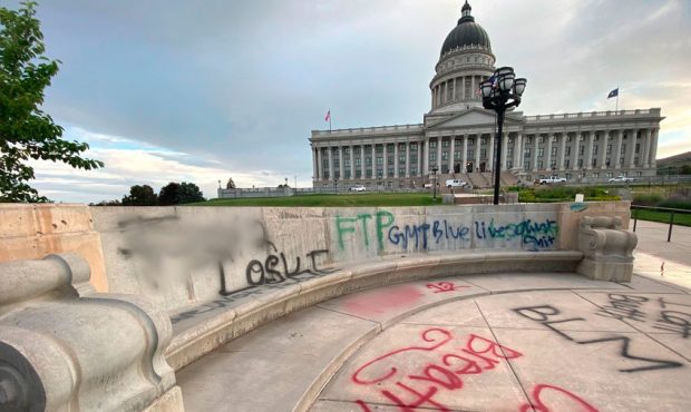 Vandalism can be seen on the grounds at the Utah State Capitol Building the morning after protests ...
