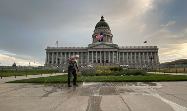 Crews wash away graffiti from the grounds of the Utah State Capitol Building on Sunday, May 31, 202...
