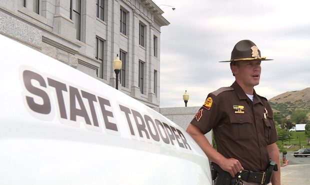 UHP Troopers Protect Protesters From Man With Knife