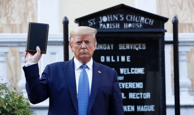President Donald Trump holds a Bible as he visits outside St. John's Church across Lafayette Park f...