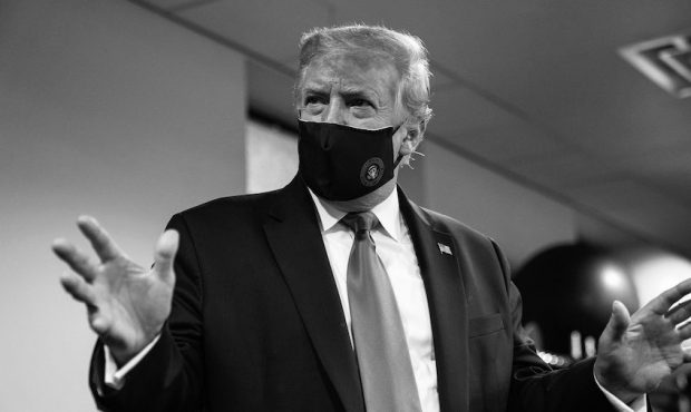 President Donald Trump wears a face mask during the coronavirus pandemic....