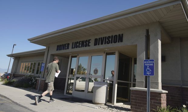 FILE: A man walks into the Driver License Division for the state of Utah on July 9, 2019 in Orem, U...