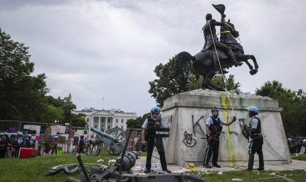 WASHINGTON, DC - JUNE 22:  U.S. Park Police stand guard after protesters attempted to pull down the...