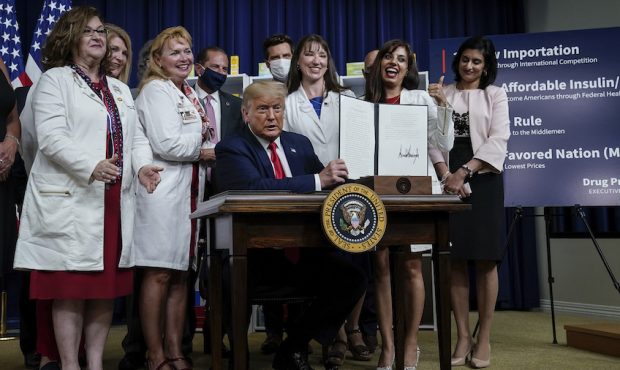 WASHINGTON, DC - JULY 24: U.S. President Donald Trump signs executive orders on prescription drug p...