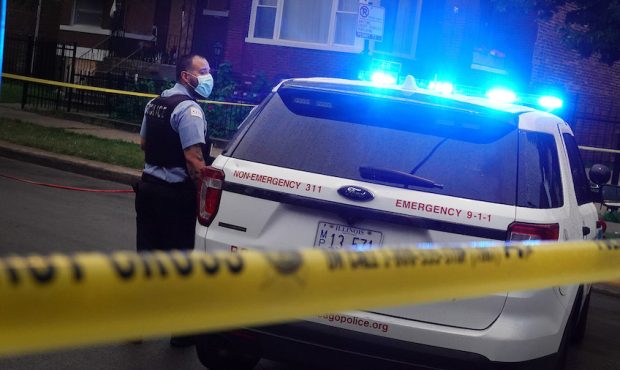 CHICAGO, ILLINOIS - JULY 21: Police investigate the scene of a shooting in the Auburn Gresham neigh...
