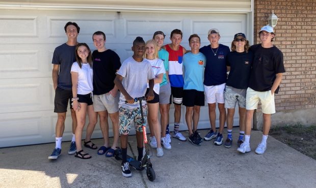 A dozen recent graduates from Davis High School pooled their cash to surprise Ty Burningham with a ...