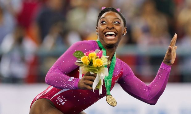 Gold medalist Simone Biles of United States gets scared by a bee at the medal ceremony after the Wo...
