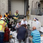 Preservation specialists begin the process of cutting into and retrieving items from the time capsule within the capstone of the Salt Lake Temple on May 18, 2020, at the Church History Library.
