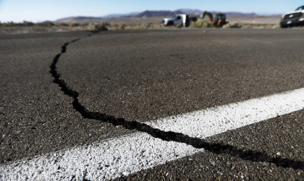 FILE: A crack stretches across the road after a 6.4 magnitude earthquake struck the area on July 4,...
