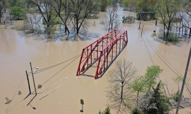 MIDLAND, MICHIGAN - MAY 20: A aerial view of floodwaters flowing from the Tittabawassee River into ...
