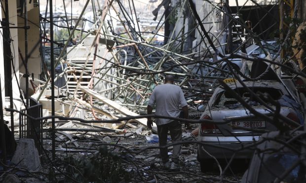 BEIRUT, LEBANON - AUGUST 05: A man walks through debris on a residential street, devastated by an e...