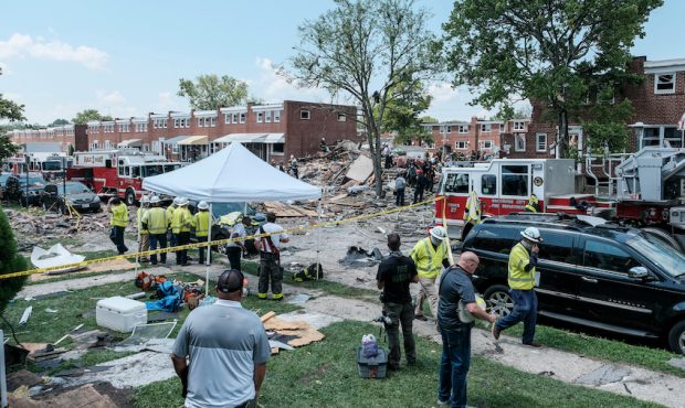 BALTIMORE, MD - AUGUST 10: First responders search for survivors at the scene of an explosion on Au...