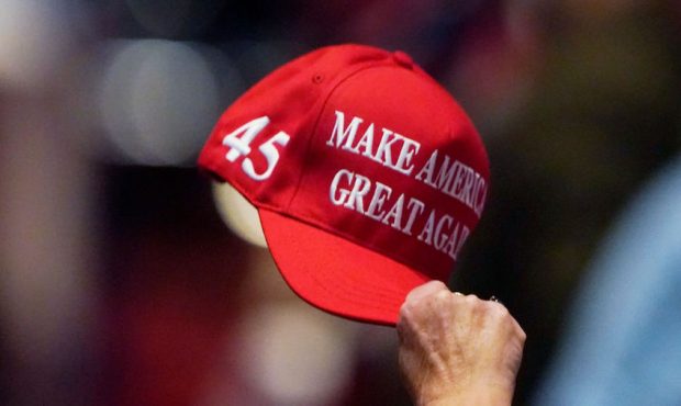 Delegate holds up a hat on the first day of the Republican National Convention at the Charlotte Con...