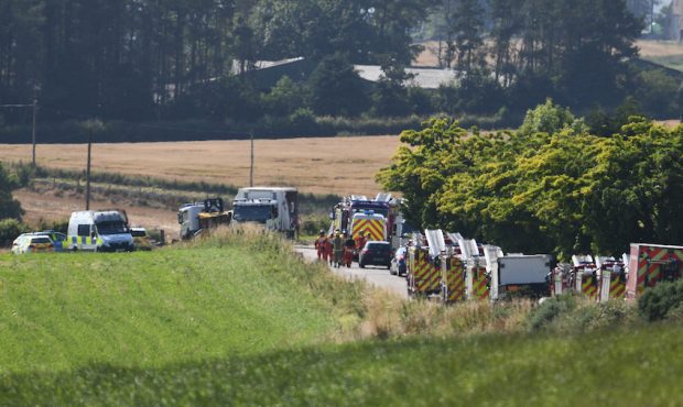 STONEHAVEN, SCOTLAND - AUGUST 12: Emergency services attend the scene of a train derailment on Augu...