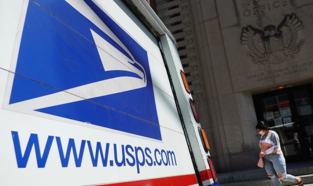 CHICAGO, ILLINOIS - AUGUST 13: A postal vehicles sits in front of a United State Postal Service fac...