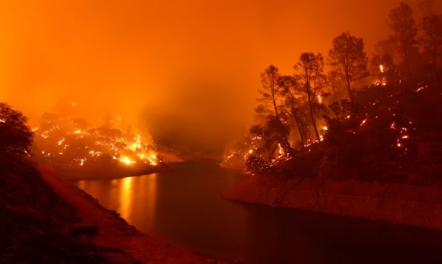 NAPA, CALIFORNIA - AUGUST 18: The banks around Lake Berryessa smolder after the LNU Lightning Compl...