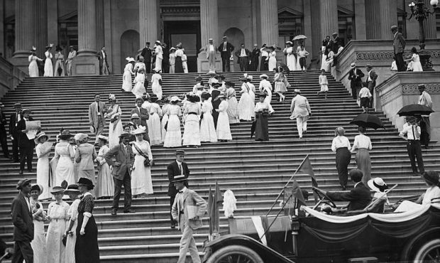 Suffragettes representing nearly every state in the United States of America ascending the steps of...