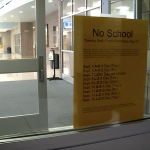 A flyer displayed in a Pleasant Grove High School doorway showing the first few days of the modified schedule.