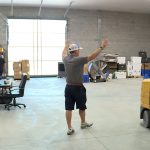 Marcus Sorensen gestures around the company's mostly empty warehouse.