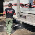Crews were busy Saturday morning cleaning their trucks and equipment after returning home from a three-week rotation, fighting wildfires in California.