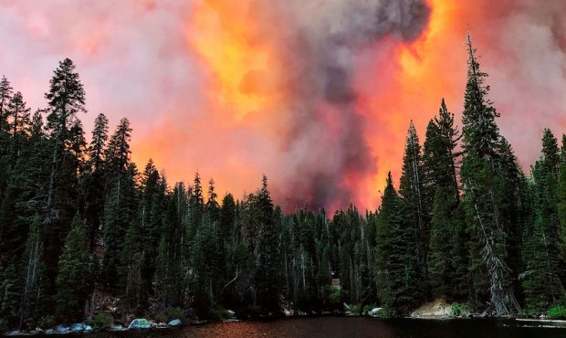 Smoke from the Creek Fire billows beyond a ridge as seen from Huntington Lake on Saturday, Sept. 5,...