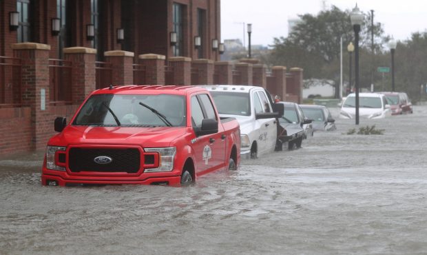 PENSACOLA, FL - SEPTEMBER 16: Vehicles are seen in a flooded street as Hurricane Sally passes throu...