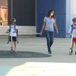 Seth and Brett Borland have been walking or riding their scooters to school for the last five years. (KSL-TV)