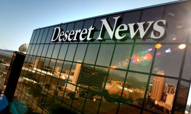 Young Electric Sign company workers install the new Deseret News sign Saturday, July 2, 2011, on th...