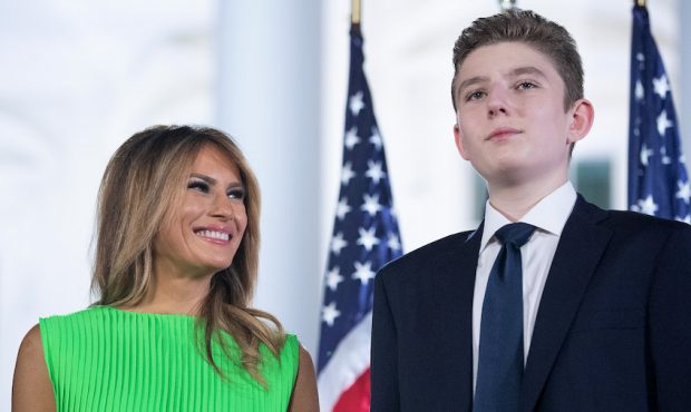 FILE: First lady Melania Trump (L) looks at her son Barron Trump after U.S. President Donald Trump ...