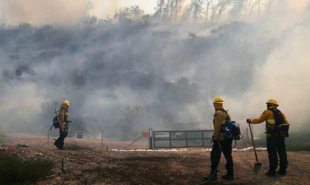 IRVINE, CALIFORNIA - OCTOBER 26: Firefighters work during the Silverado Fire in Orange County on Oc...