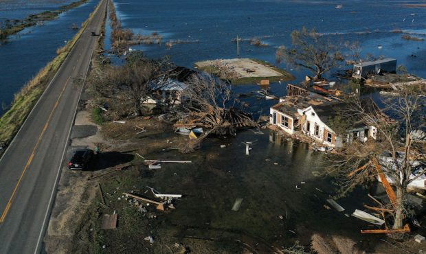 An aerial view of flood waters from Hurricane Delta surrounding structures destroyed by Hurricane L...