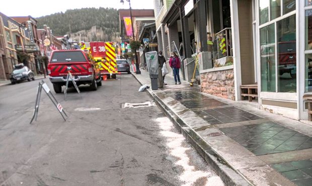 Crews work to contain a glycol chemical spill on Main Street in Park City, Utah on Saturday, Octobe...