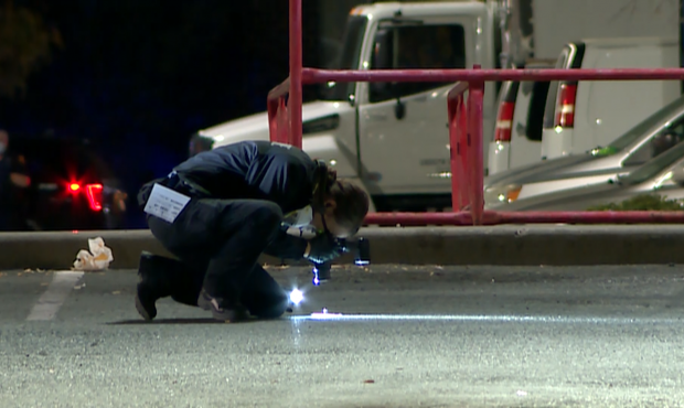 Authorities investigate after an alleged armed robbery in a Lowes parking lot in Salt Lake City on ...
