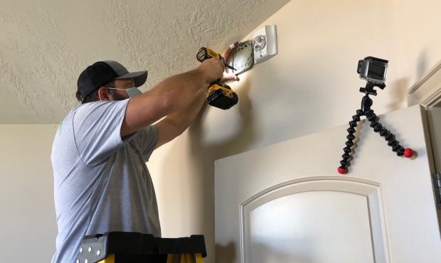 Volunteers installed strobe light smoke detectors at a Draper family's home Thursday. (KSL-TV)...