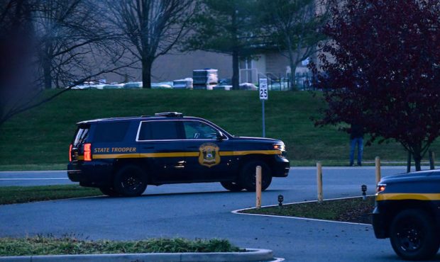 Police vehicles form a barricade at the entrance as President-elect Joe Biden visits Delaware Ortho...