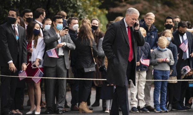 FILE: White House Chief of Staff Mark Meadows speaks on the phone on the South Lawn before Presiden...