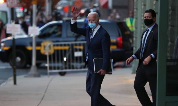 U.S. President-elect Joe Biden waves as he leaves the Queen Theater (Photo by Joe Raedle/Getty Imag...