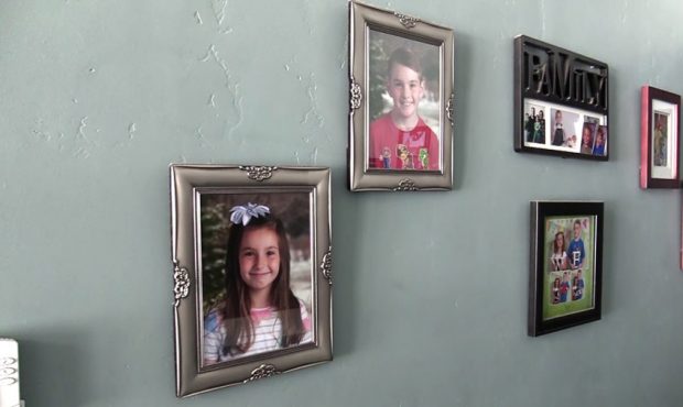 School photos of the Adams children are on the wall, but something is missing. (KSL TV)...