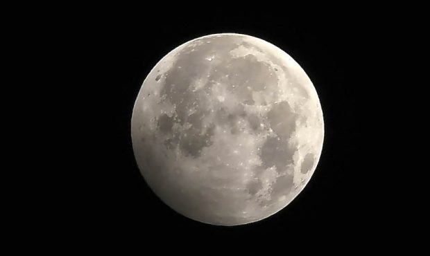 The full moon during the penumbral lunar eclipse is seen in Kathmandu on January 11, 2020. (Photo b...